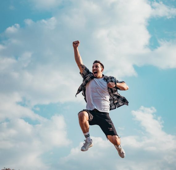 Man Jumping From A Rock